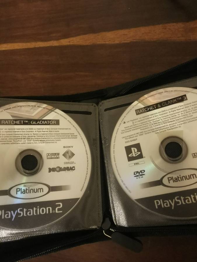 PlayStation 2 with Wireless Remote and Memory Card Including CD Case with 13 Games