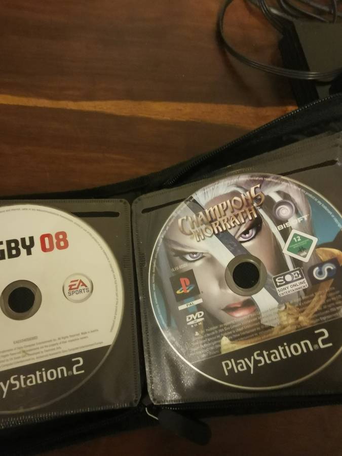 PlayStation 2 with Wireless Remote and Memory Card Including CD Case with 13 Games