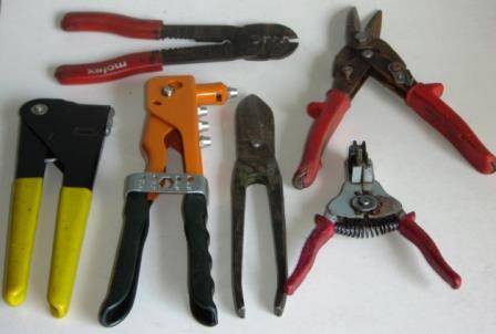 A variety of 6 Hand Tools, Pop Rivet Pliers, Wire Strippers, Tin Snips.