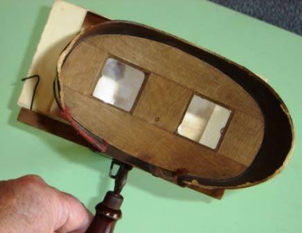 A stereo viewer with 15 photographs.