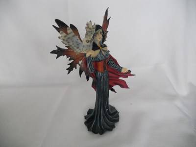 Fairy holding owl -  wearing red cape