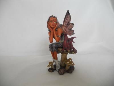 Fairy - Indian fairy sitting on toadstool with small dragon