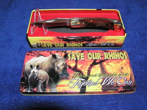 Save Our Rhinos tin with knife