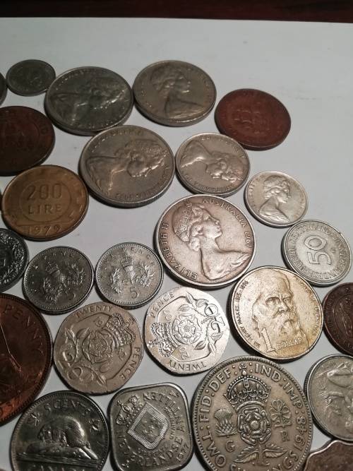 55 Mixed International coins. One bid for the lot