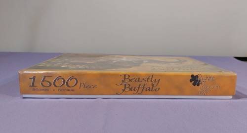 TWO PUZZLE BOXES  1500 PIECE BEASTLY BUFFALO  500 PIECE ISLAND OCEAN SCENE