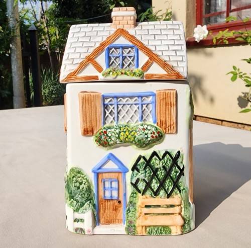 THE VILLAGE COLLECTABLE HAND PAINTED CERAMIC TEA CANNISTER DESIGNED BY ANNIE ROWE