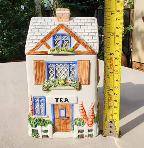 THE VILLAGE COLLECTABLE HAND PAINTED CERAMIC TEA CANNISTER DESIGNED BY ANNIE ROWE