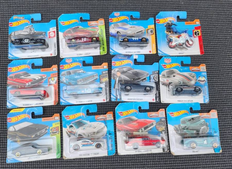 HOTWHEELS COLLECTION OF 12 DIECASTS IN ORIGINAL PACKAGING EARLY 2000 TO 2017 MODELS