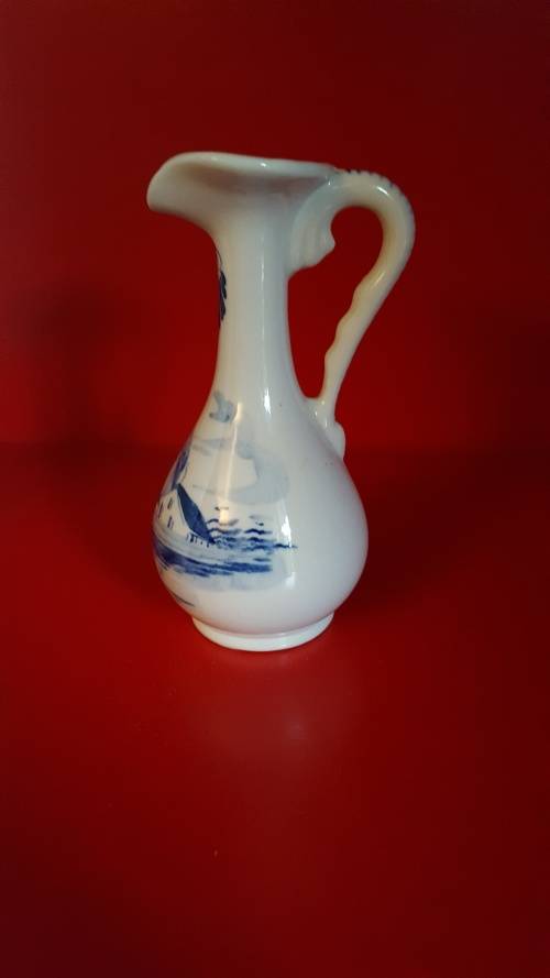 Lucia ware, Bud vase. Hand Painted in Delft Blue. Signed by the Artist.