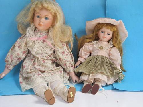 PAIR OF PORCELAIN DOLLS