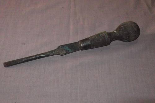 Old flat screwdriver with wooden handle