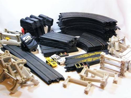 Lot of 38 slot car racing tracks - assorted mostly Marchon with 4 controllers, power supply & 2 cars