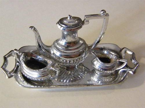 Small tray with small teapot(with lid), cream jug and sugar bowl - mark on tray is a swan with a T