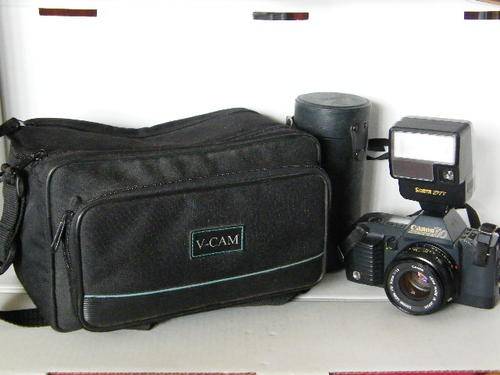 Canon T70 camera with 50mm Canon f1.8 lens plus extra lens and camera bag