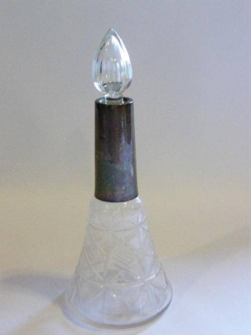 Antique perfume bottle with hallmarked silver top as per photo