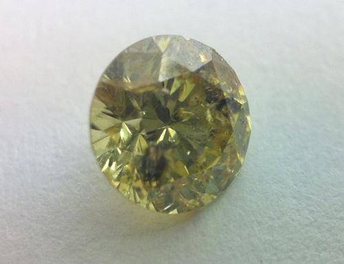 55 point yellow diamond with some inclusions - Round brilliant - as per photo