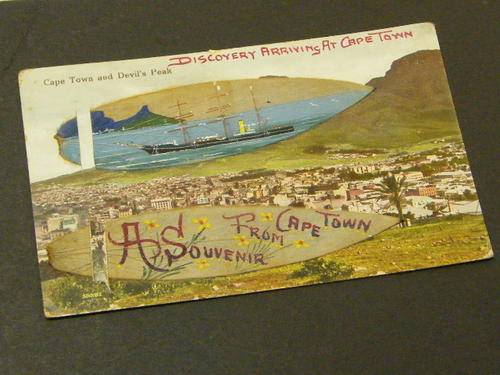 Postcard plus painting on leaf of the Discovery arriving at Cape Town late 1920`s - as per photo