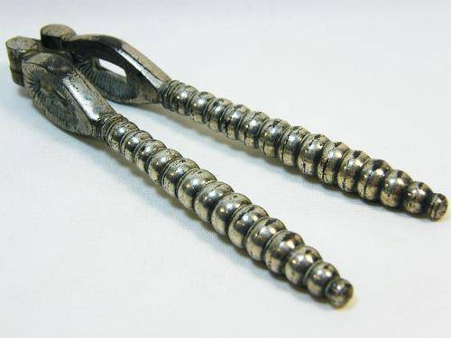 Vintage silverplated nutcracker with banded handles - as per photo