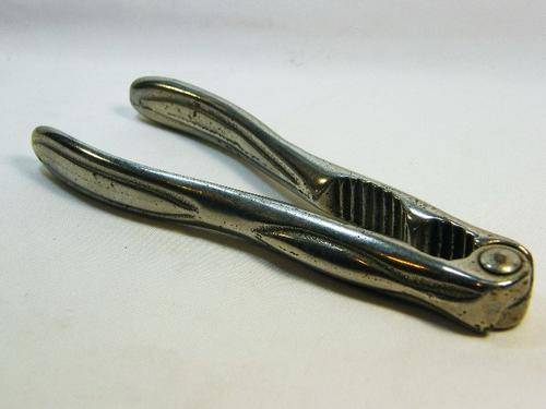 Vintage silverplated nutcracker with double opening - as per photo