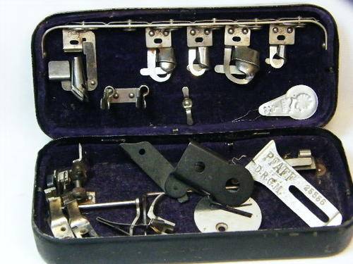Antique Pfaff sewing machine attachment kit with parts - as per photo