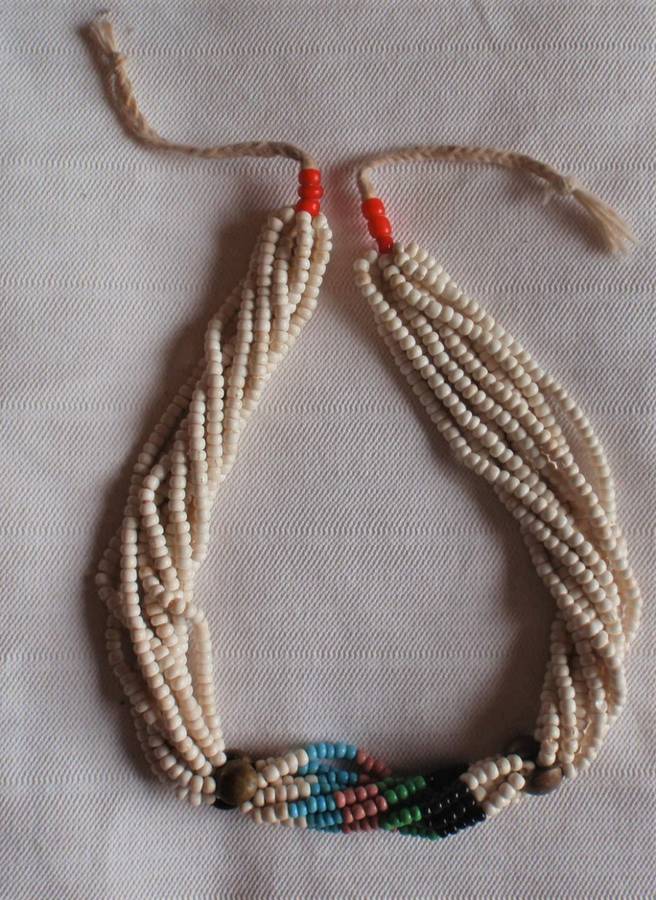 Authentic Xhosa beadwork - expertly made in the Transkei. Ten strings of beadwork with brass buttons
