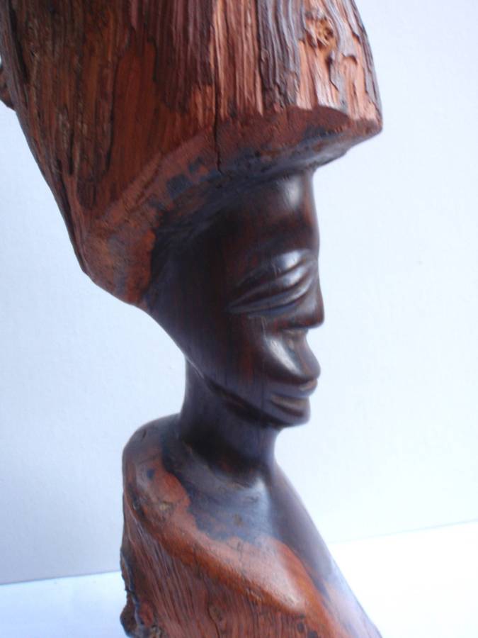 Authenic African wood carving.  Interesting, unique avant-garde dimensions and use of wood.