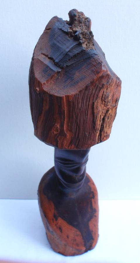 Authenic African wood carving.  Interesting, unique avant-garde dimensions and use of wood.