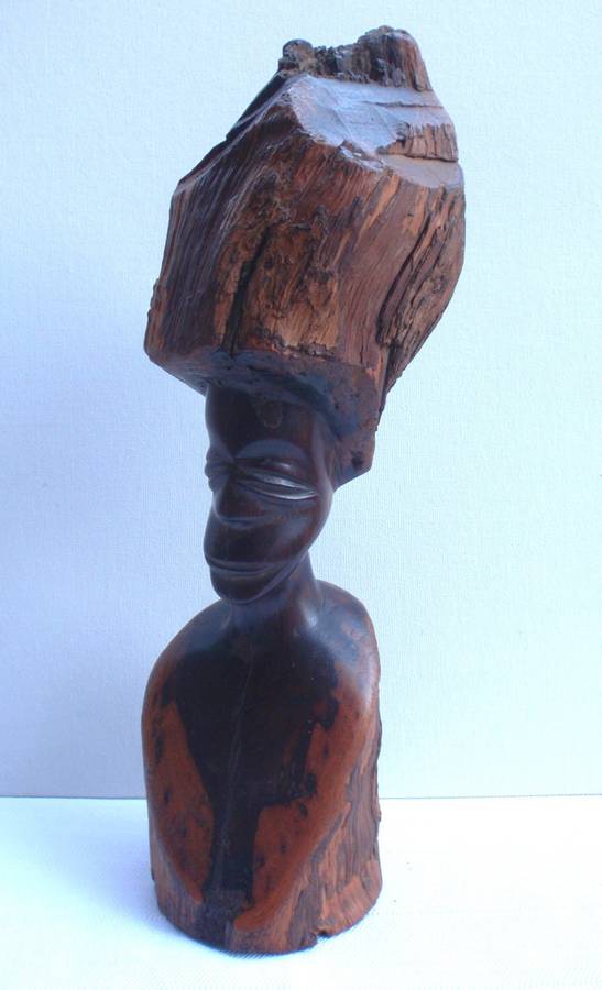 Authenic African wood carving.  Interesting, unique avant-garde dimensions and use of wood.