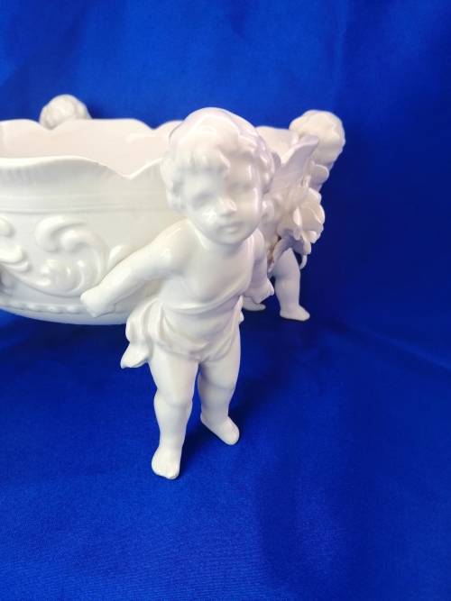 Beautiful White Italian Continental blanc de Chine center bowl depicting four putti Cherubs