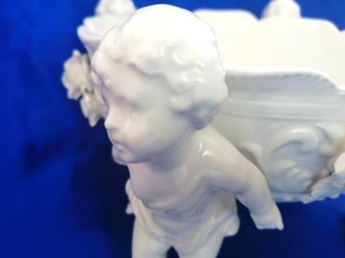 Beautiful White Italian Continental blanc de Chine center bowl depicting four putti Cherubs
