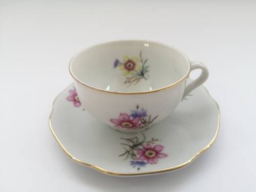 Pretty Demitasse cup and saucer White with flower design and gold trim