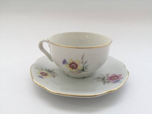 Pretty Demitasse cup and saucer White with flower design and gold trim