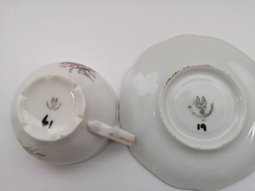 Pretty Demitasse cup and saucer White with flower design and gold trim