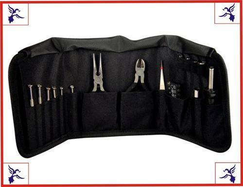 Compact travel size tool set in a black nylon case.