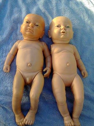VINTAGE NEW BORN BABY GIRL AND BOY DOLLS ON AUCTION TOGETHER