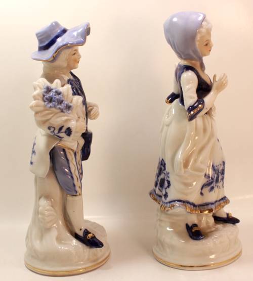 Man and Woman Matching Pair of Porcelain Ornamental Figurines in Victorian Finery.