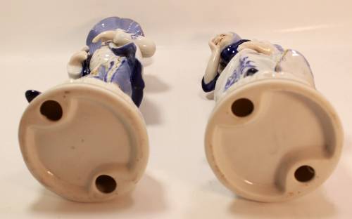Man and Woman Matching Pair of Porcelain Ornamental Figurines in Victorian Finery.