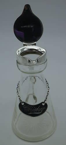 Whisky Noggin with hallmarked silver lid and label. HB Johnson and Company, B/ham 1910. 11cm