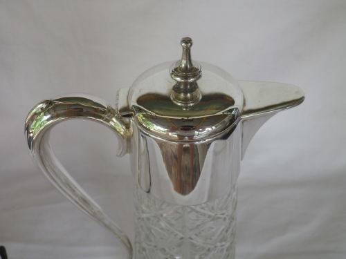 Vintage Silver plate and cut glass claret jug. 30cm tall
