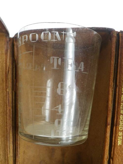 Vintage travelling medicine measure in leather case. Finnigans Bond Street, London