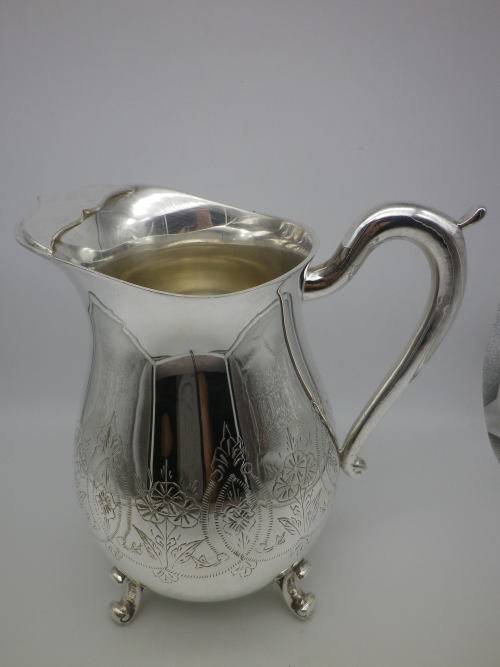 LARGE SILVER PLATED VINTAGE  JUG WITH ICE LIP LOVELY CHASED DECORATION. EXCELLENT CONDITION 20CM