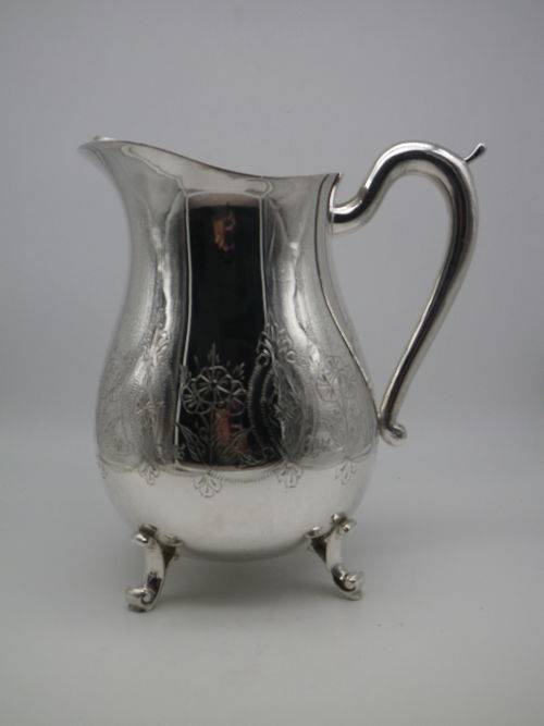 LARGE SILVER PLATED VINTAGE  JUG WITH ICE LIP LOVELY CHASED DECORATION. EXCELLENT CONDITION 20CM