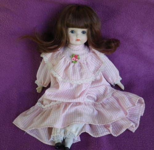 DELIGHTFUL CHARMINGLY DRESSED PORCELAIN DOLL. GREAT HAIR & CLOTHES. V GOOD CONDITION