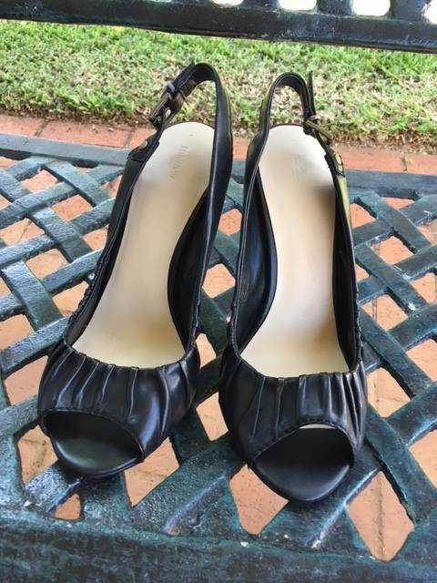 Black peep-toe sling back heels