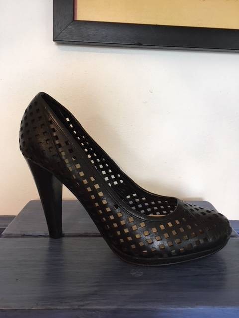 High black heels featuring small square cut outs