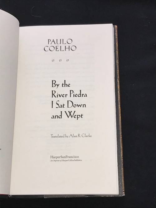 BY THE RIVER PIEDRA I SAT DOWN & WEPT BY PAULO COELHO 1ST EDITION