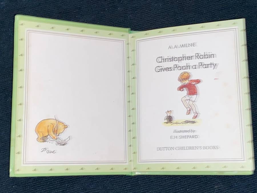 CHRISTOPHER ROBIN GIVES POOH A PARTY BY A.A. MILNE
