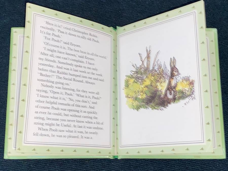 CHRISTOPHER ROBIN GIVES POOH A PARTY BY A.A. MILNE