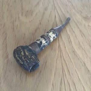 Old bronze-coloured pipe