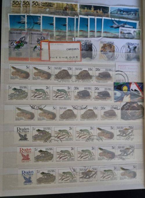 A4 Stock Album stacked with mostly used Union and RSA stamps